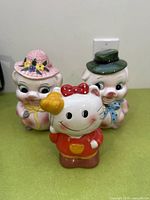 Front view of three ceramic banks showing design details