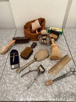 Overview of entire grooming kit showing all 14 items spread out on table