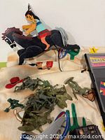 Army men, rider cut-out, fabric, puzzle box partial