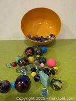 assorted marbles, bounce balls, bowl overview