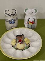 Full set showing deviled egg tray with hen and two chicks, grey mouse shaker, white mouse shaker