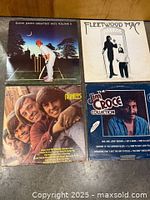 Four vinyl album covers arranged in grid