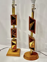 Front view of both teak cubist lamps showing rotating mosaic glass blocks
