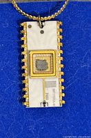 Front view of Intel MF1702A EPROM pendant on chain