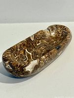 Full view of polished onyx tray showing shape and patterns