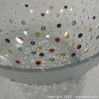 Interior view showing clear textured glass and multicolour raised dots