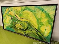 Front angled view of framed abstract painting