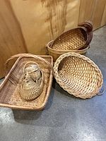 Group of four wicker baskets as listed