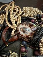 Assorted beaded necklaces, brown resin bangle, gold-tone chain