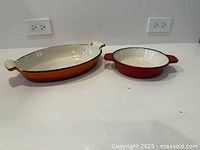 Top view of both cocottes showing interiors and size difference