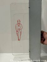 Full view of acrylic sign with metal housing