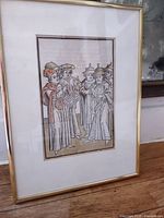 framed woodcut leaf front view showing coloured image and matting