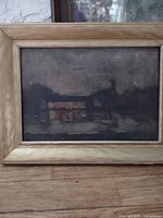 Framed dark oil painting front view