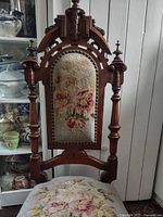 Full view of chair showing wood frame and upholstery