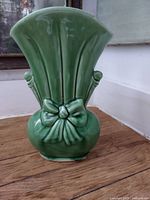 Front view of green ceramic vase