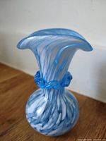 Full view of vase upright showing swirl pattern and flared rim