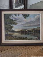 Full view of framed oil landscape painting