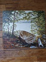 Front view of painting showing rowboat scene