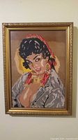 Full view of framed needlepoint portrait