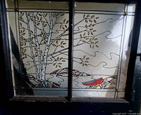 Full view of stained glass window showing entire nature scene