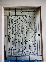 Full view of stained glass panel installed in frame