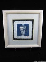 Full view of framed print with blue vase image