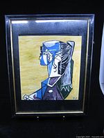 Front view of framed cubist painting