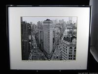 Full view of framed photograph under glass