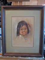 Full view of framed pastel portrait.