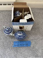 Teapot, lidded sugar bowl and box holding teacups