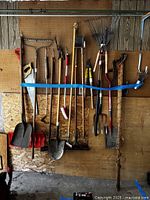 All tools hanging on pegboard held by blue strap