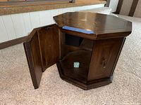 Table door open showing interior storage and hardware