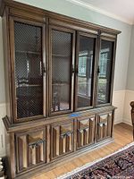 Front view of complete china cabinet showing display and storage sections