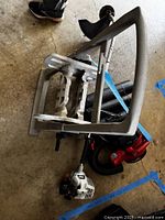 Echo GT-200R trimmer, Craftsman blower parts, plastic hose reel stacked together