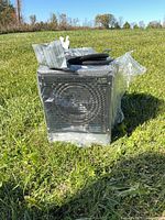 Front view of heater showing grille and documentation