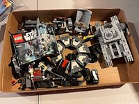 Top view of box containing loose LEGO Star Wars 75183 parts and partially built sections