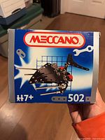 Front of Meccano 502 box showing branding and assembled model graphic