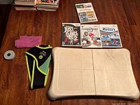 Balance board, games, sleeve and strap on table