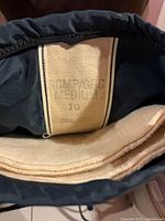 Label inside navy RCMP boot marked medium size 10