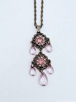 Full view of necklace showing pendant design and chain