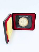 Coin in open presentation case showing obverse design and inscriptions