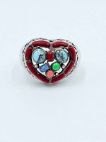Front view of sterling silver heart ring with multi-color gemstone inlay