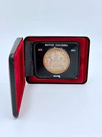 Coin in open case, obverse visible, text "British Columbia 1871 1971 SILVER"