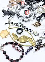 Top view of assorted jewelry pieces spread out