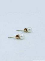 front view of pearl stud earrings showing posts and pearls