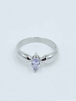 Top view of sterling silver ring with marquise tanzanite