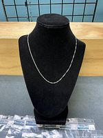 Chain displayed on bust to show length and drape