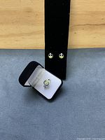 Ring and earrings displayed on velvet and in ring box