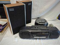 Group view showing Panasonic boombox, compact CD boombox and pair Sony speakers