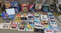 Entire lot showing boxed models, collector tin, certificate and array of blister cards